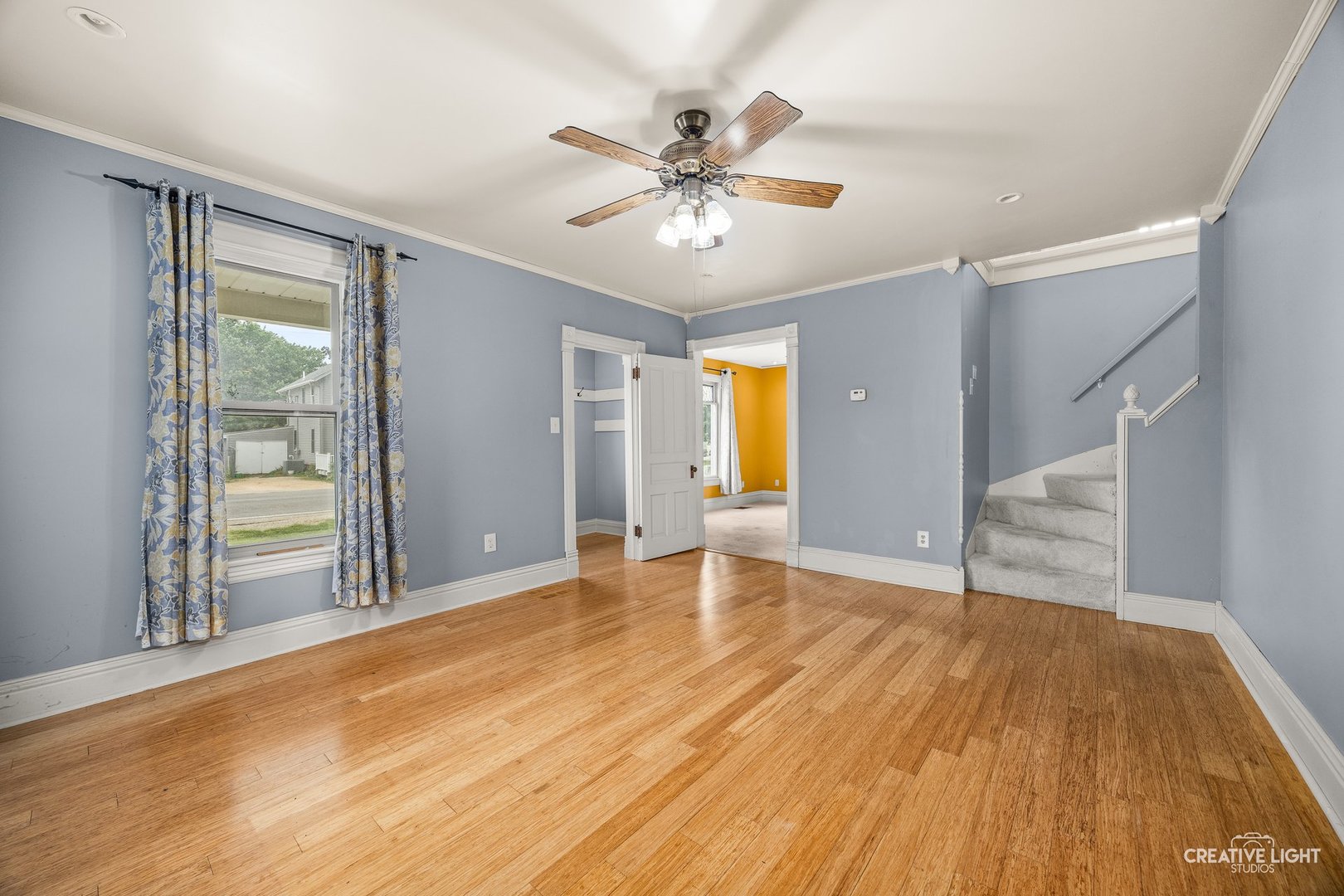 209 North Shabbona Road Shabbona, IL 60550 - Photo 6 of 25 a view of an empty room with wooden floor and a window