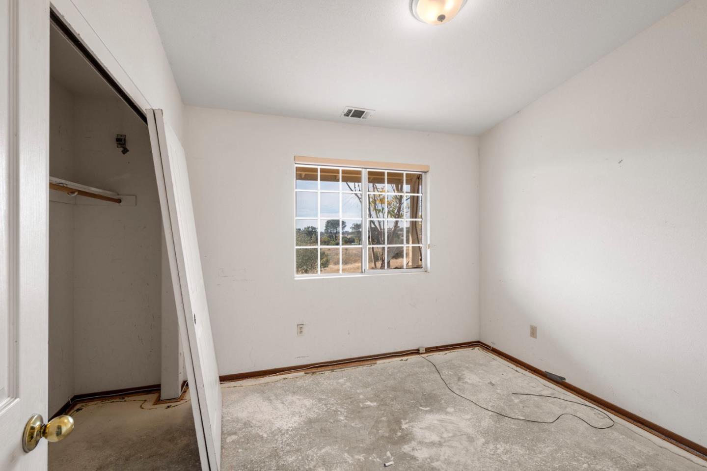 4505 4x Ranch Road Burson, CA 95225 - Photo 16 of 52 an empty room with windows