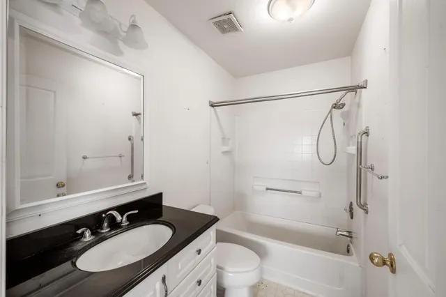 a kitchen that has a cabinets and a table in it