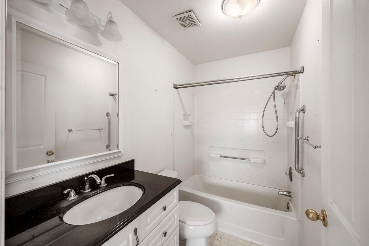 4505 4x Ranch Road Burson, CA 95225 - Photo 20 of 52 a bathroom with a granite countertop sink mirror toilet and bathtub