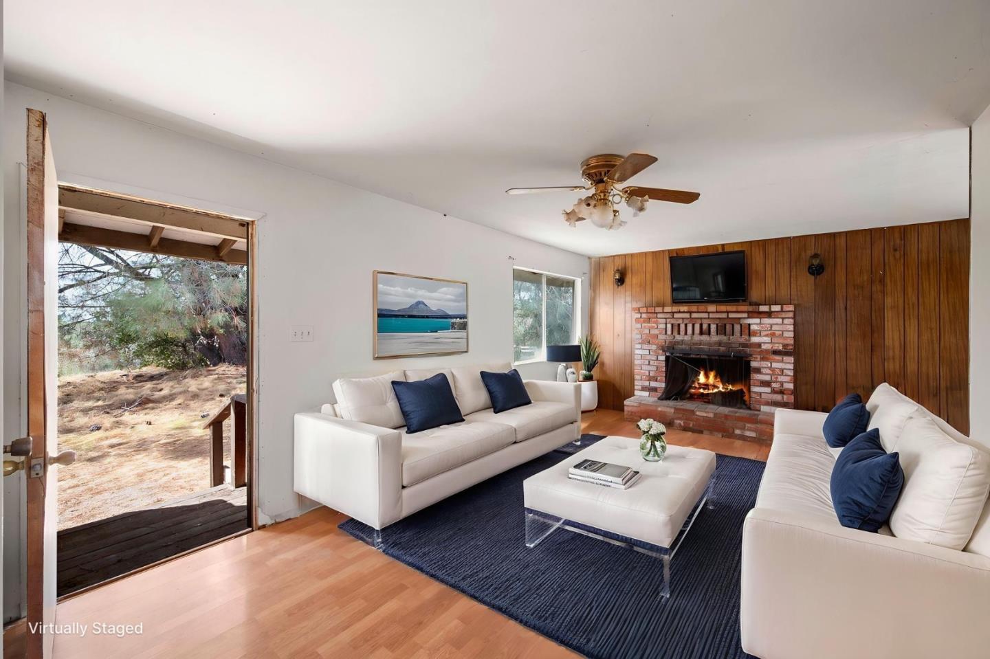 4505 4x Ranch Road Burson, CA 95225 - Photo 26 of 52 a living room with furniture a fireplace and a large window