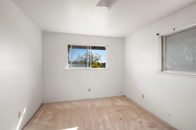 an empty room with windows