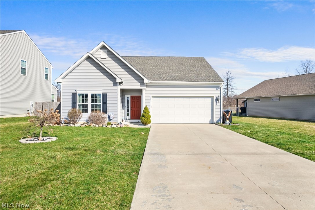 378 Springbrook Circle Elyria, OH 44035 - Photo 1 of 33 View of front of home featuring a front lawn and a garage