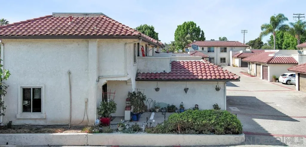 320 Grapevine Road, Unit 12 Vista, CA 92083 - Photo 3 of 50 a front view of a house with garden