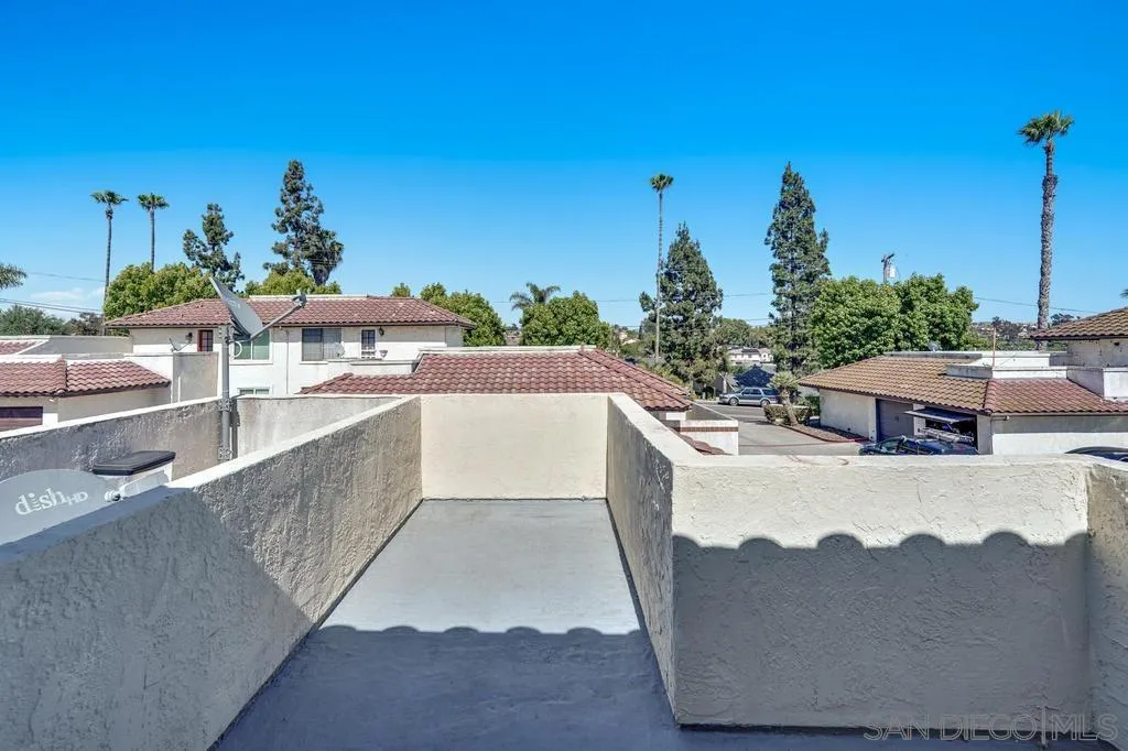 320 Grapevine Road, Unit 12 Vista, CA 92083 - Photo 36 of 50 a view of a house with pool and chairs