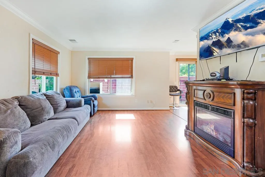320 Grapevine Road, Unit 12 Vista, CA 92083 - Photo 4 of 50 a living room with furniture and a fireplace