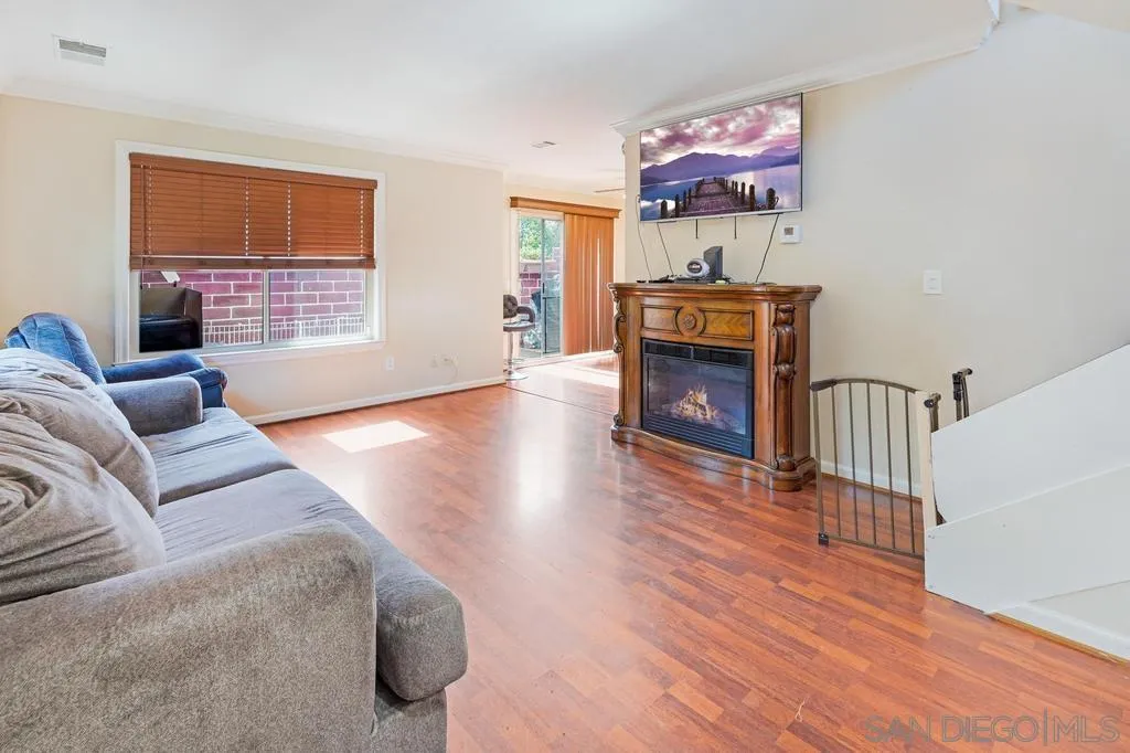 320 Grapevine Road, Unit 12 Vista, CA 92083 - Photo 5 of 50 a living room with furniture and a fireplace