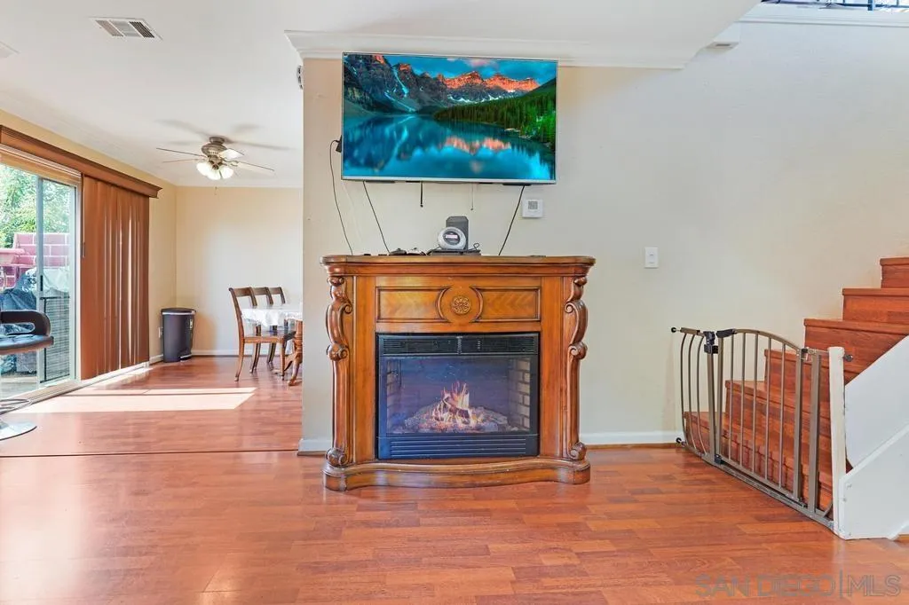 320 Grapevine Road, Unit 12 Vista, CA 92083 - Photo 6 of 50 a view of an empty room with a fireplace and a window