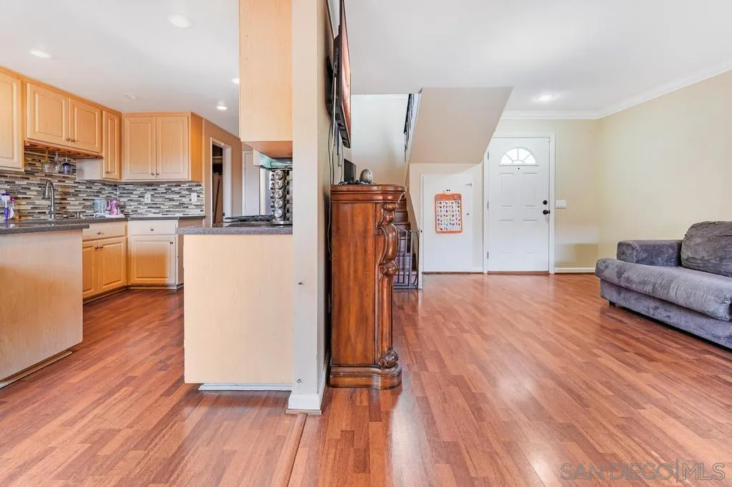 320 Grapevine Road, Unit 12 Vista, CA 92083 - Photo 8 of 50 a view of kitchen with furniture and wooden floor
