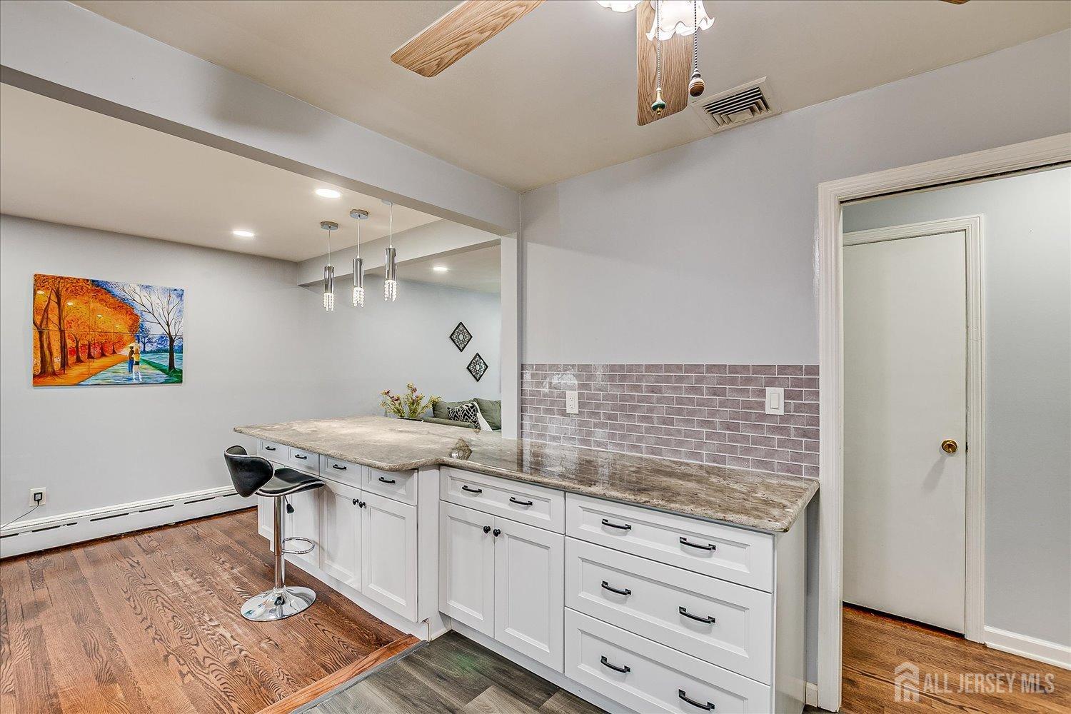 149 Vineyard Road Edison, NJ 08817 - Photo 16 of 40 a room with granite countertop a sink and a stove top oven