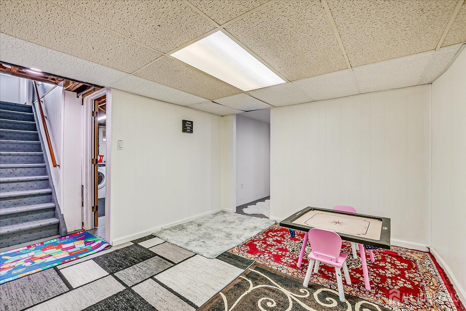 149 Vineyard Road Edison, NJ 08817 - Photo 26 of 40 a bedroom with a bed and a wooden floor