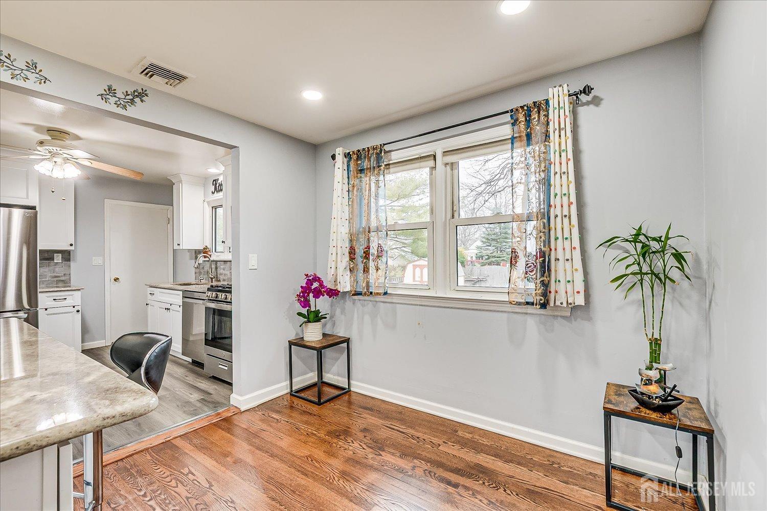 149 Vineyard Road Edison, NJ 08817 - Photo 10 of 40 a living room with furniture and a potted plant