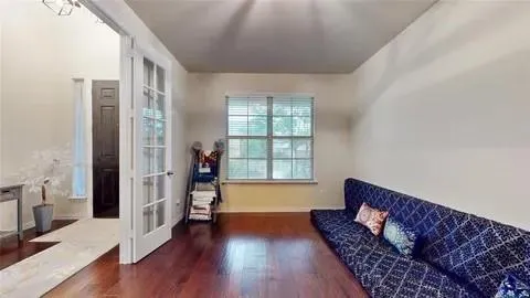 a living room with furniture and a window