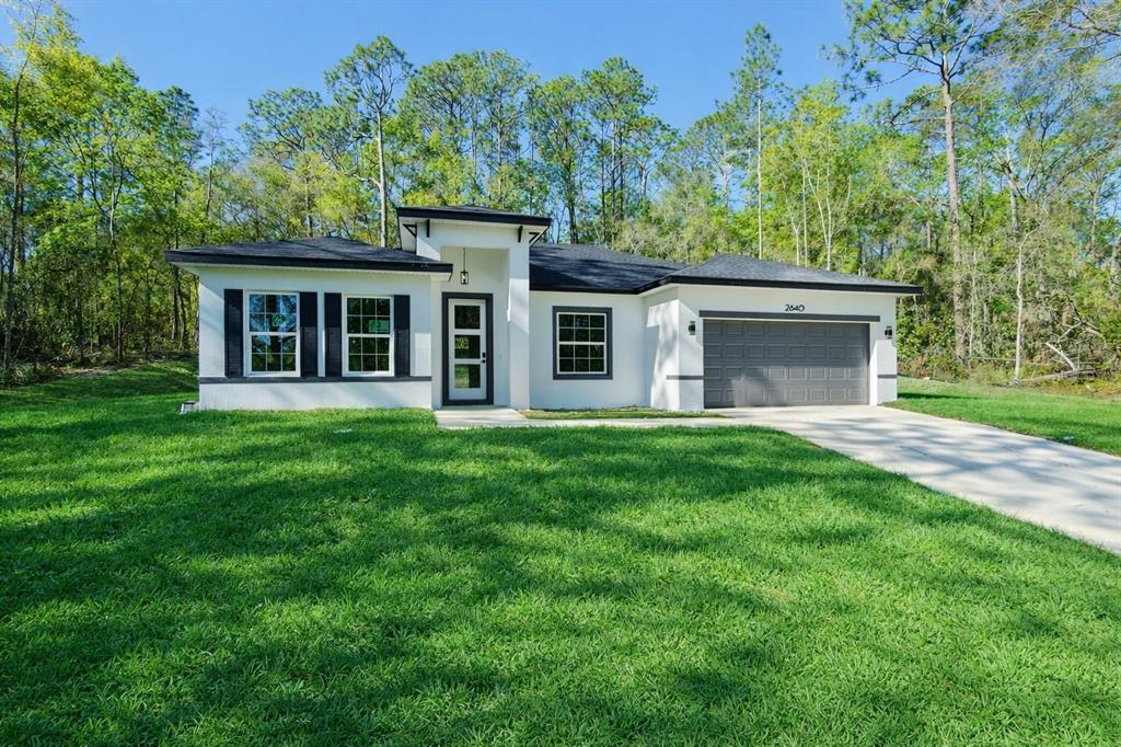 2640 West Fairway Loop Citrus Springs, FL 34434 - Photo 1 of 39 front view of a house with a yard