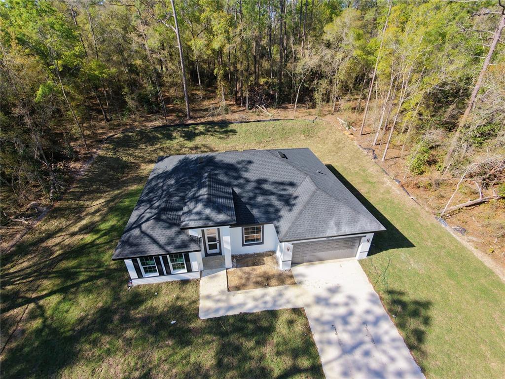 2640 West Fairway Loop Citrus Springs, FL 34434 - Photo 2 of 39 a view of swimming pool with a yard