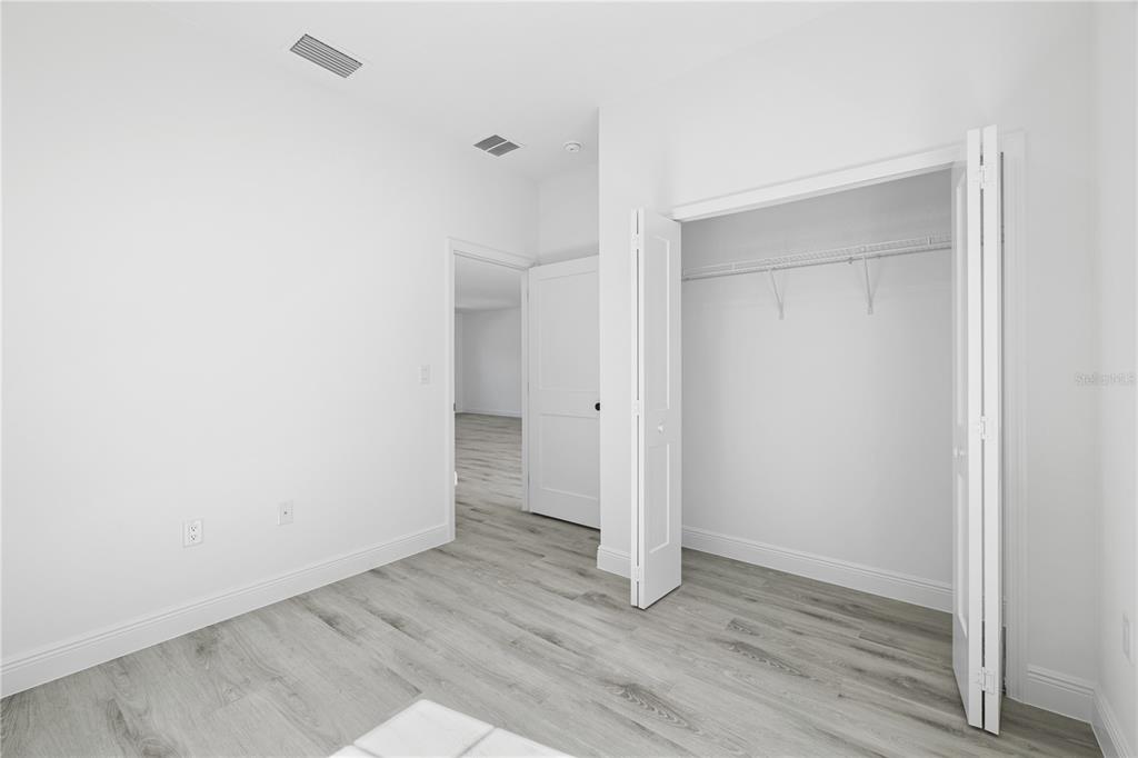 2640 West Fairway Loop Citrus Springs, FL 34434 - Photo 21 of 39 a view of an empty room with wooden floor