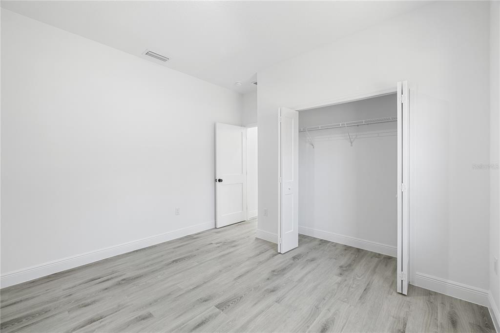 2640 West Fairway Loop Citrus Springs, FL 34434 - Photo 24 of 39 a view of an empty room with wooden floor