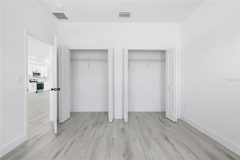 2640 West Fairway Loop Citrus Springs, FL 34434 - Photo 27 of 39 wooden floor in an empty room