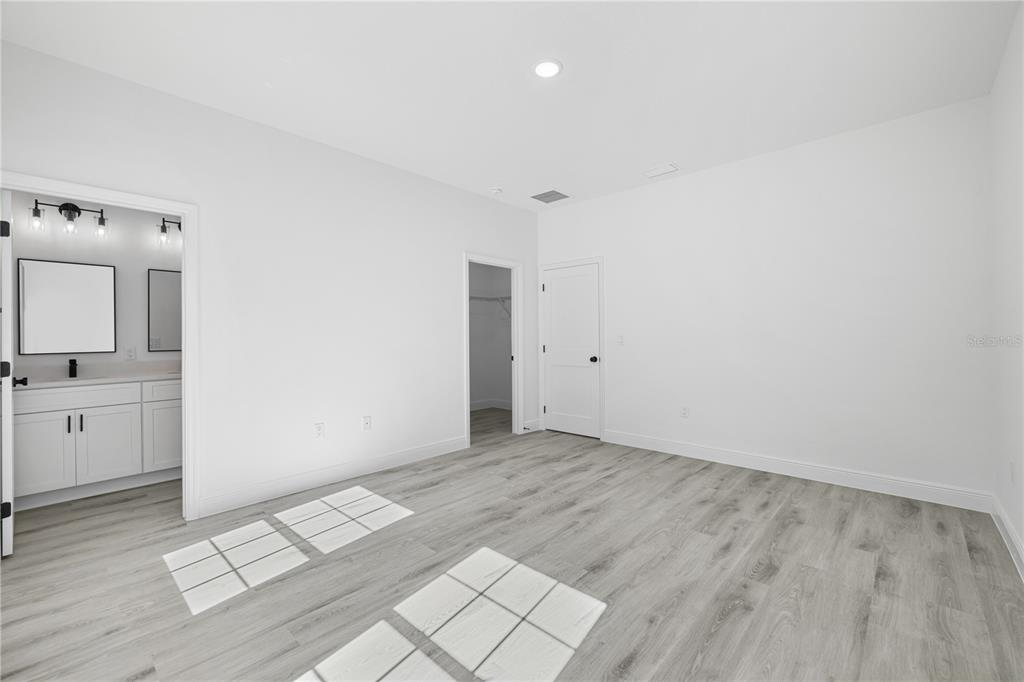 2640 West Fairway Loop Citrus Springs, FL 34434 - Photo 35 of 39 a view of room with window and hardwood floor