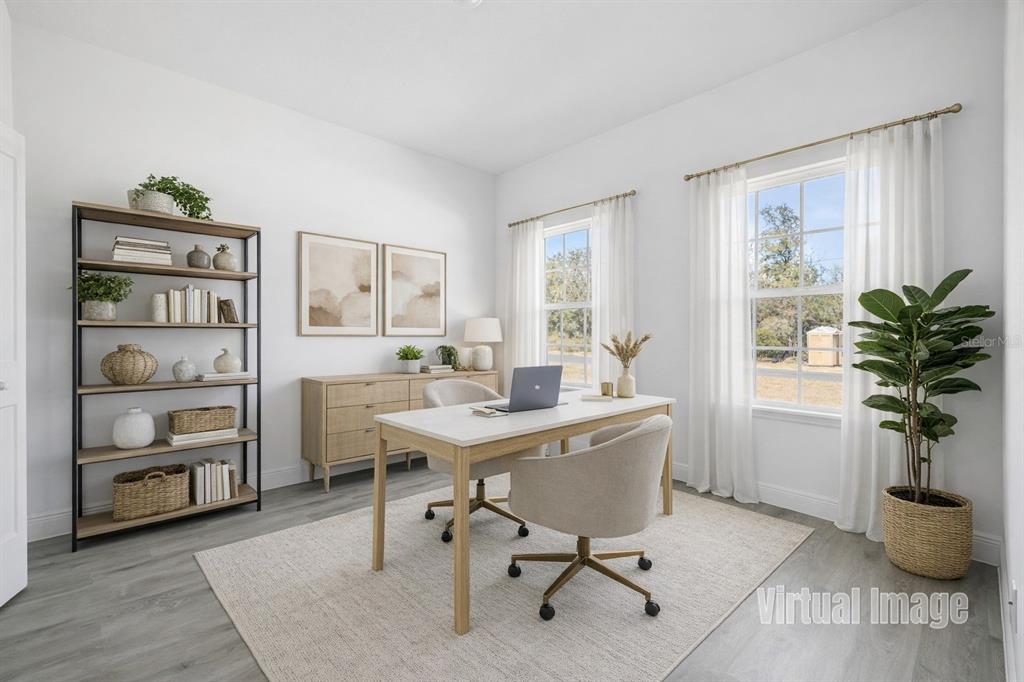 2640 West Fairway Loop Citrus Springs, FL 34434 - Photo 5 of 39 a view of a workspace with furniture and a potted plant