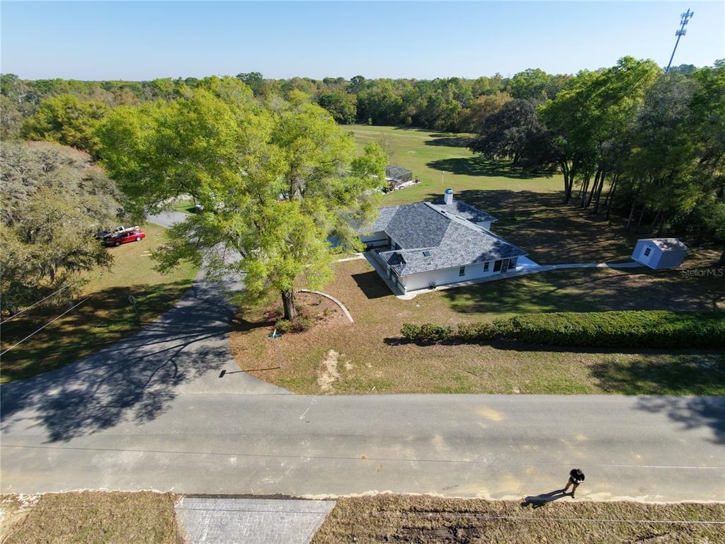 2640 West Fairway Loop Citrus Springs, FL 34434 - Photo 6 of 39 a view of a street with a park