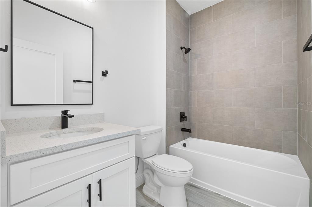 2640 West Fairway Loop Citrus Springs, FL 34434 - Photo 9 of 39 a bathroom with a sink a toilet and a bathtub