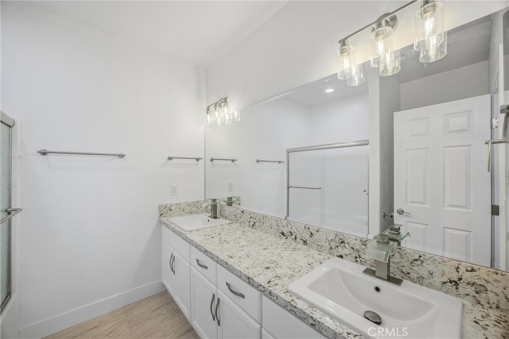 11788 Buckwheat Road Pinon Hills, CA 92371 - Photo 27 of 61 a bathroom with a sink and a mirror