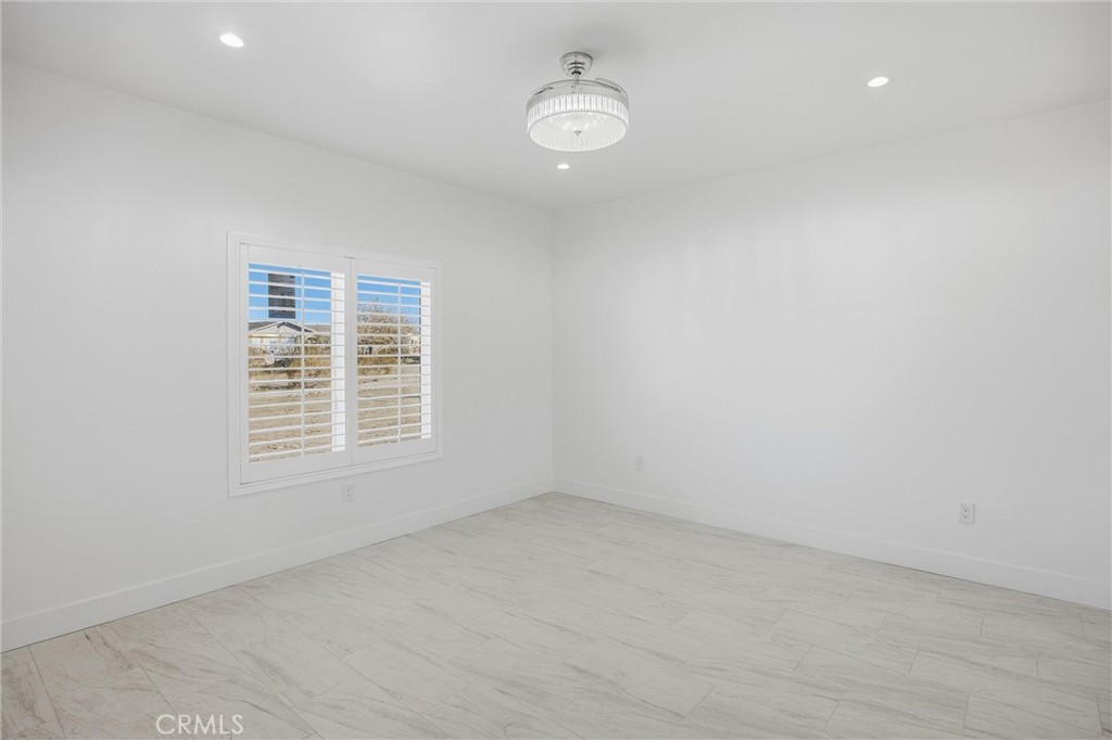 11788 Buckwheat Road Pinon Hills, CA 92371 - Photo 29 of 61 an empty room with a window