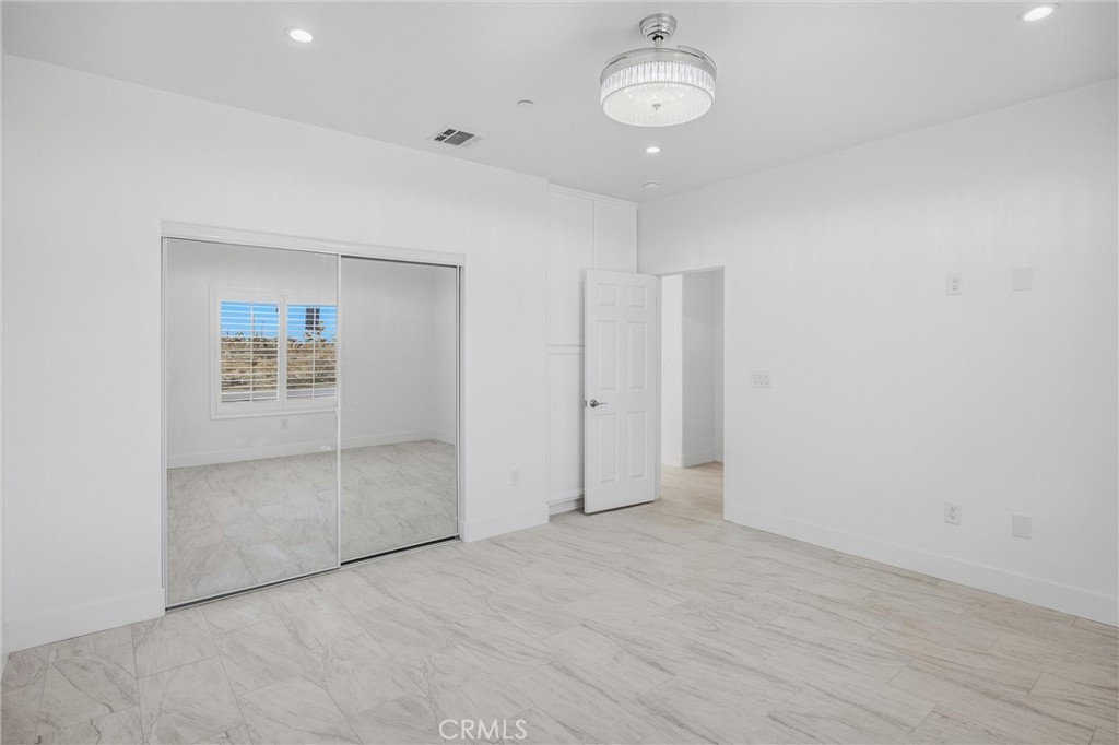 11788 Buckwheat Road Pinon Hills, CA 92371 - Photo 30 of 61 an empty room with a empty space and windows