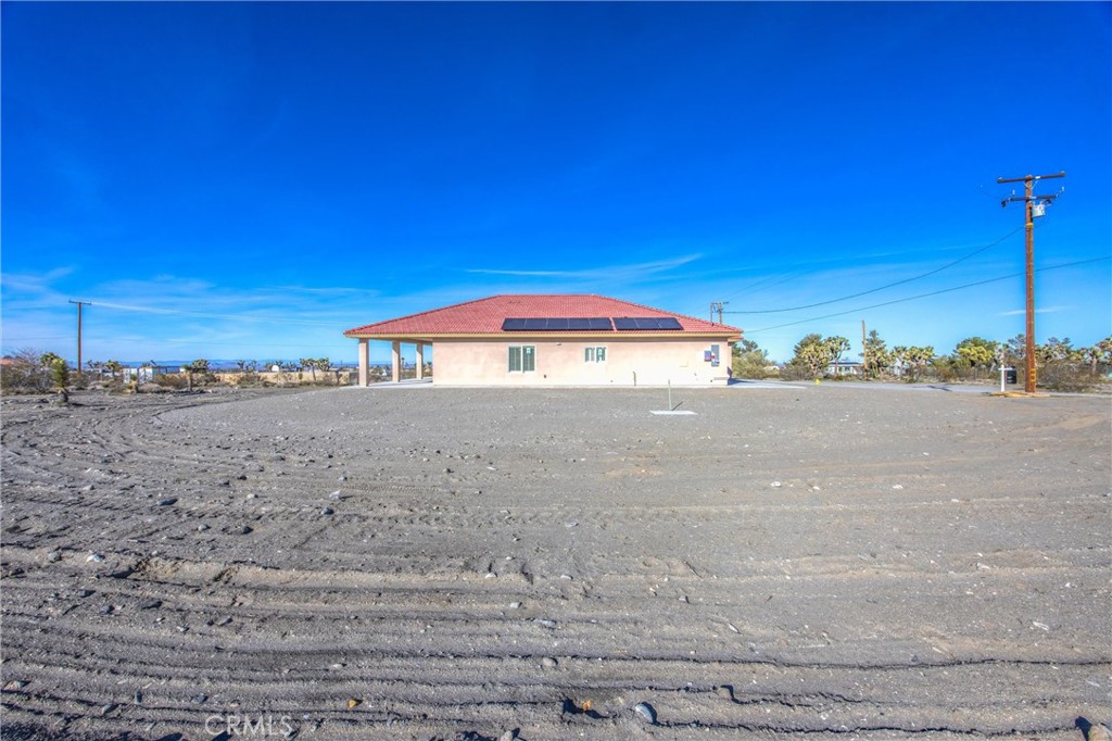 11788 Buckwheat Road Pinon Hills, CA 92371 - Photo 32 of 61 a view of a swimming pool and a yard