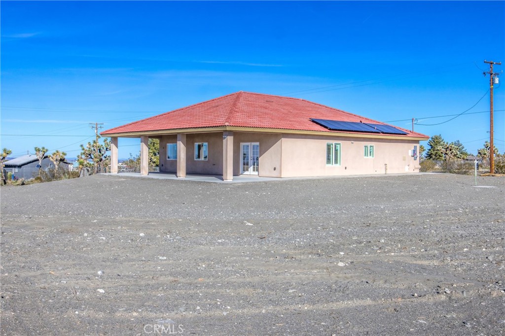 11788 Buckwheat Road Pinon Hills, CA 92371 - Photo 35 of 61 a view of house with a yard