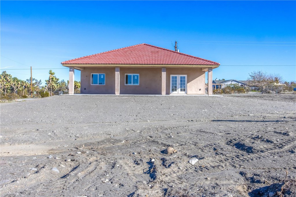 11788 Buckwheat Road Pinon Hills, CA 92371 - Photo 38 of 61 a front view of a house with a yard