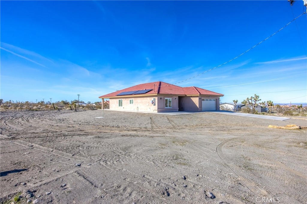 11788 Buckwheat Road Pinon Hills, CA 92371 - Photo 4 of 61 a view of big house with a yard