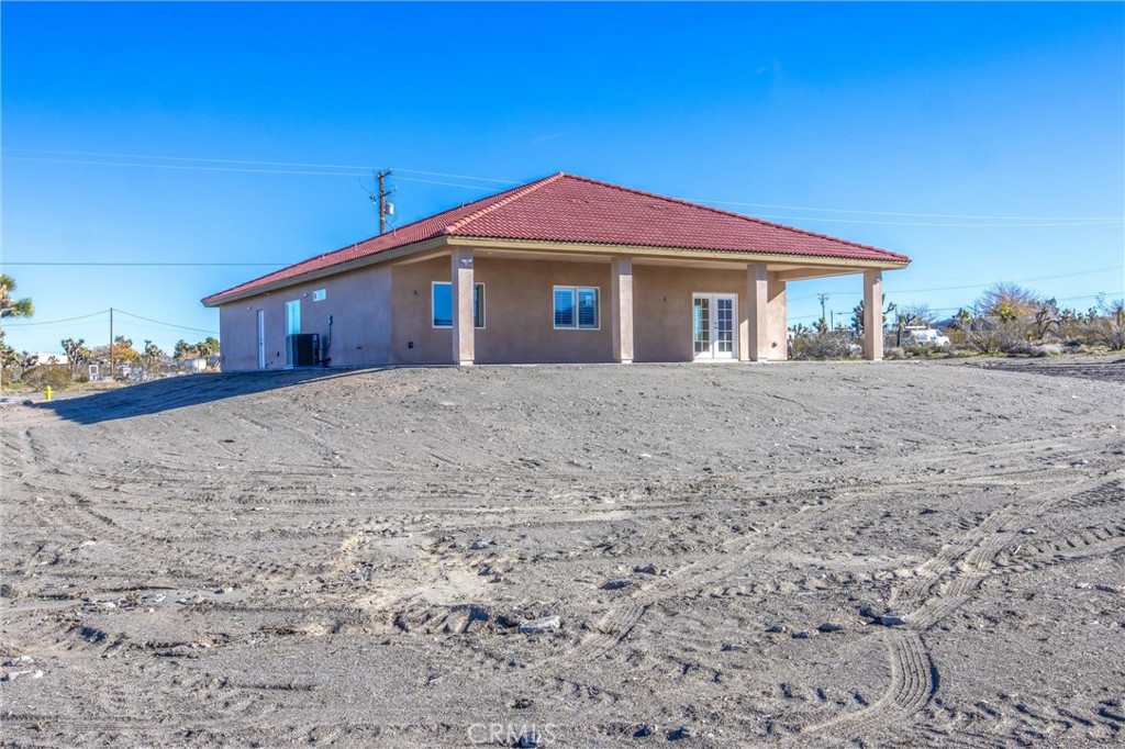 11788 Buckwheat Road Pinon Hills, CA 92371 - Photo 41 of 61 a front view of a house with a yard