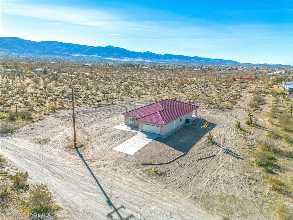 11788 Buckwheat Road Pinon Hills, CA 92371 - Photo 49 of 61 a view of a city with an ocean view