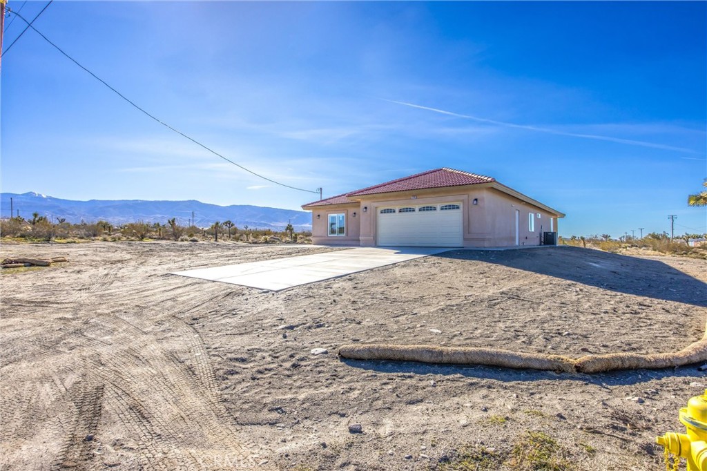 11788 Buckwheat Road Pinon Hills, CA 92371 - Photo 5 of 61 a view of a house with a yard
