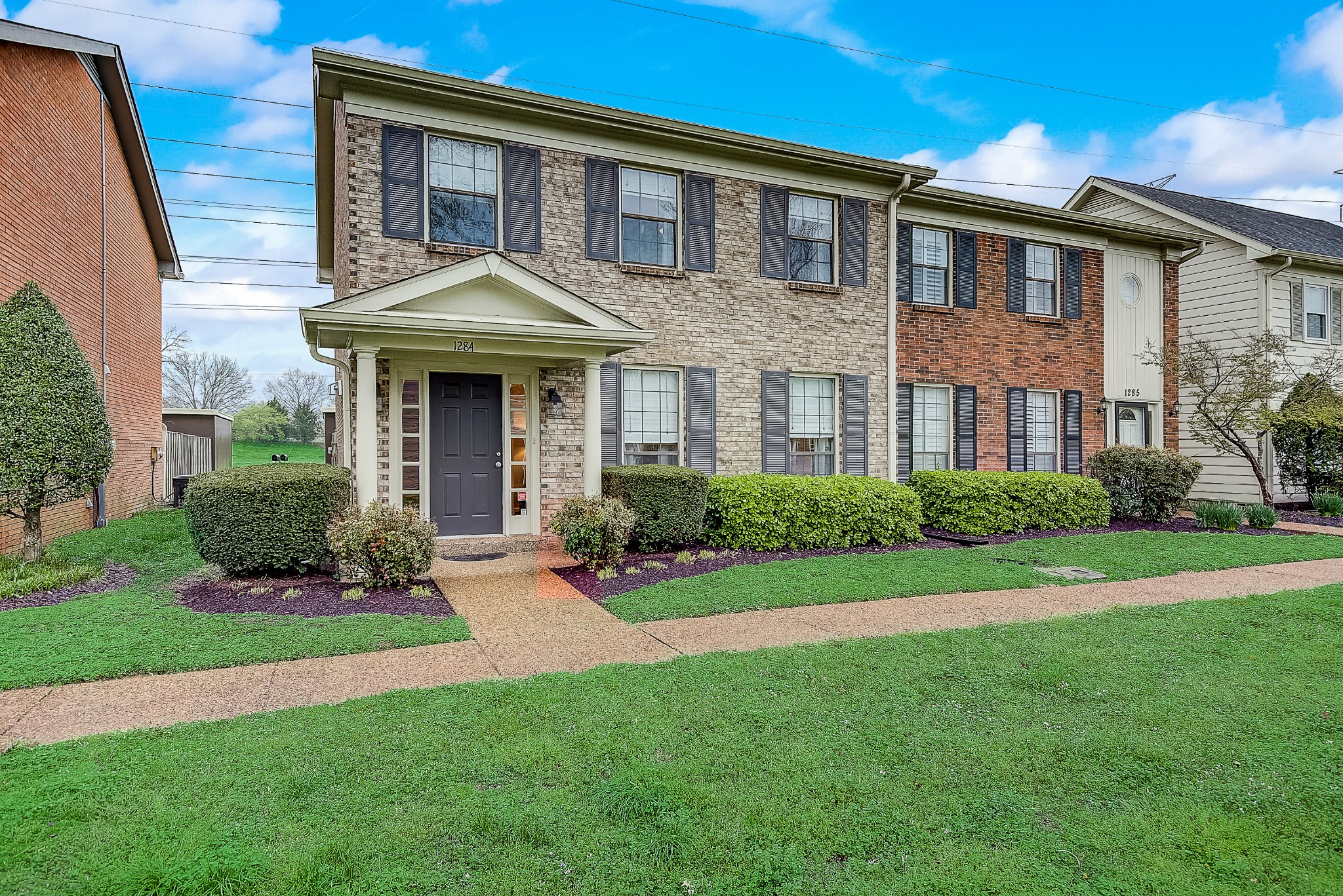1284 General George Patton Road Nashville, TN 37221 - Photo 1 of 30 a front view of a house with a yard