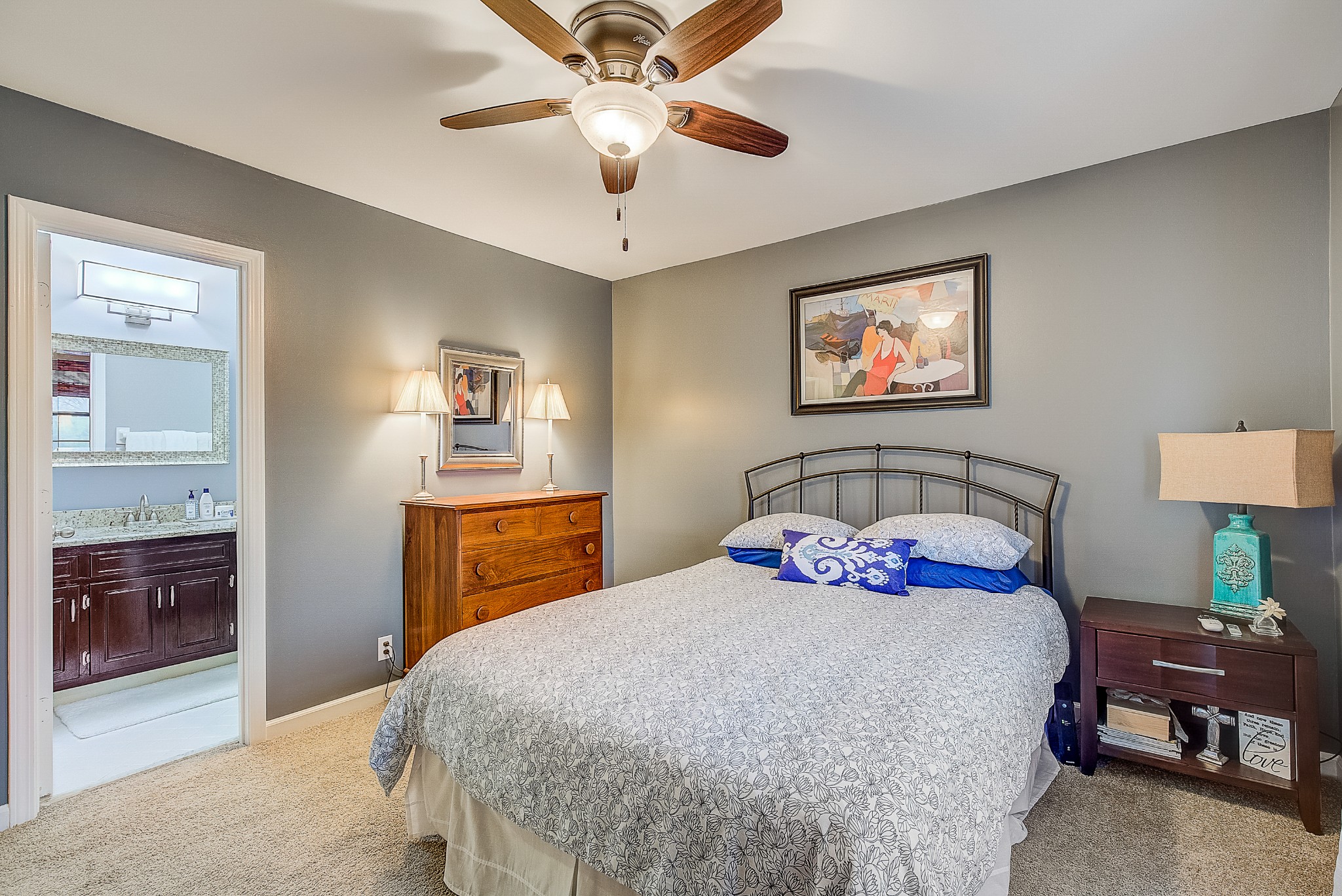 1284 General George Patton Road Nashville, TN 37221 - Photo 23 of 30 a bedroom with a bed and a chandelier