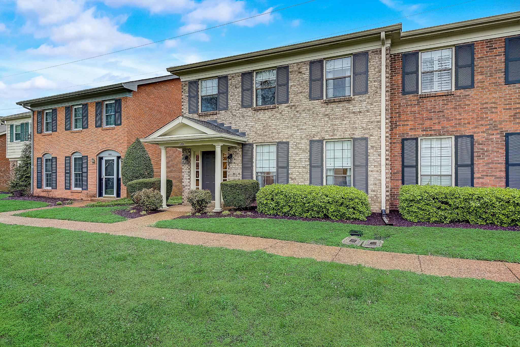 1284 General George Patton Road Nashville, TN 37221 - Photo 3 of 30 a front view of a house with a yard