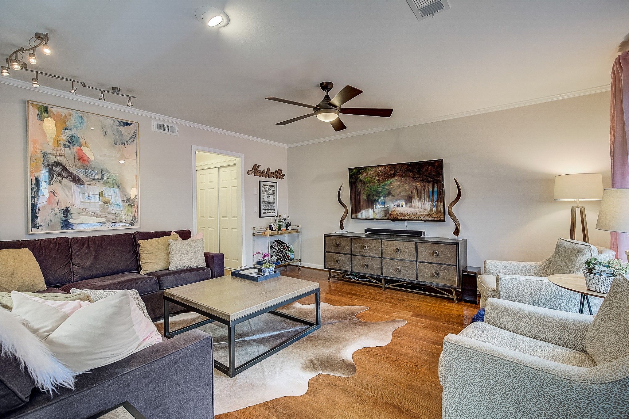 1284 General George Patton Road Nashville, TN 37221 - Photo 8 of 30 a living room with furniture a rug and a wall painting