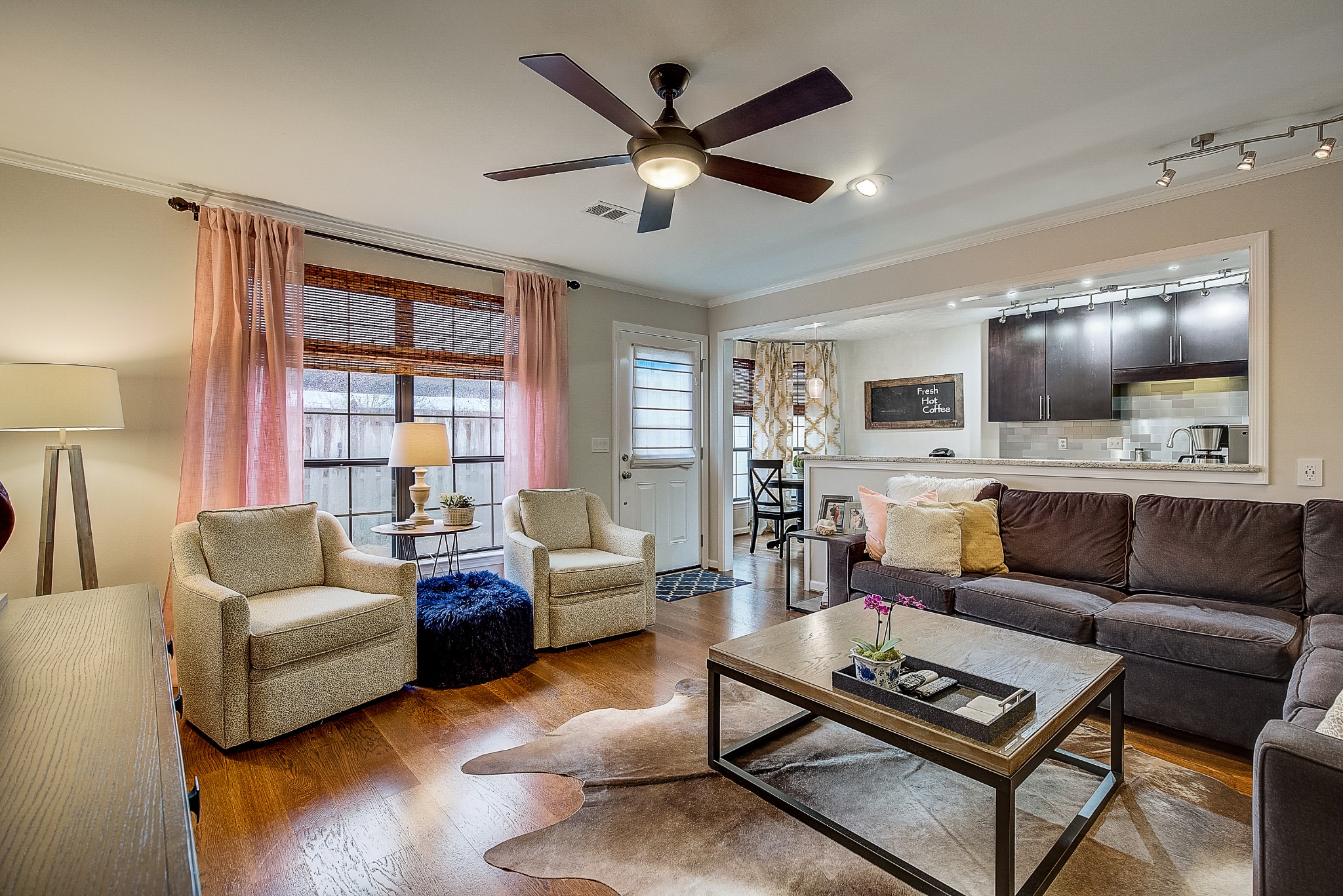 1284 General George Patton Road Nashville, TN 37221 - Photo 10 of 30 a living room with furniture and a flat screen tv with wooden floor
