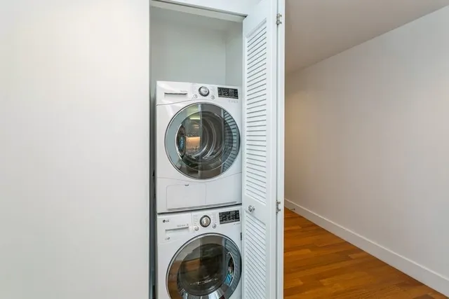 a view of a hallway with washer and dryer