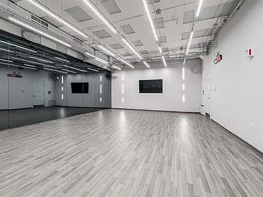 a view of a room with wooden floors and dryer