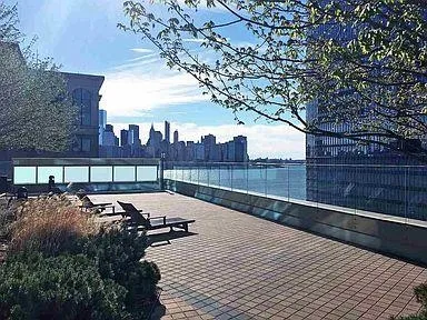 a view of a patio with table and chairs with wooden fence and floor