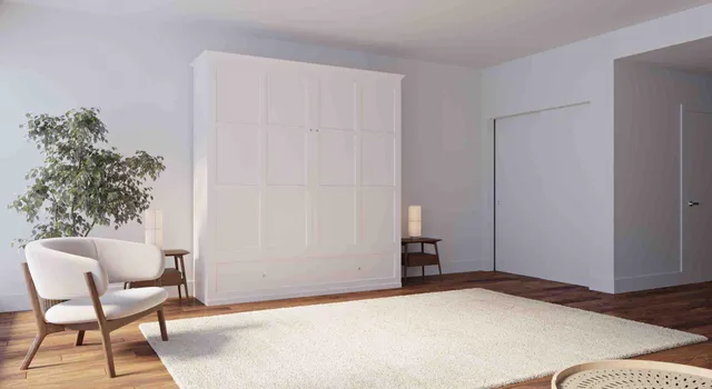 a bedroom with a bed and a chair