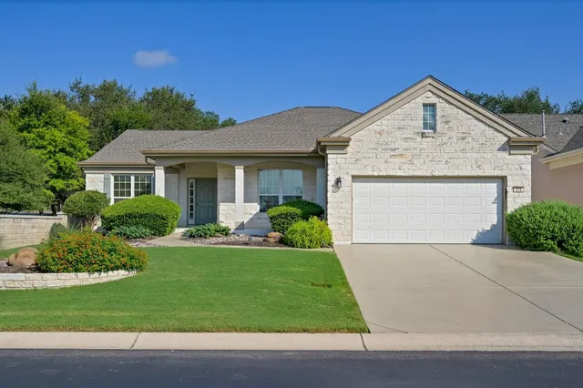 a view of front of house with a yard