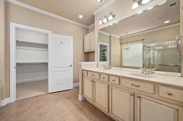 a spacious bathroom with a granite countertop sink mirror and double