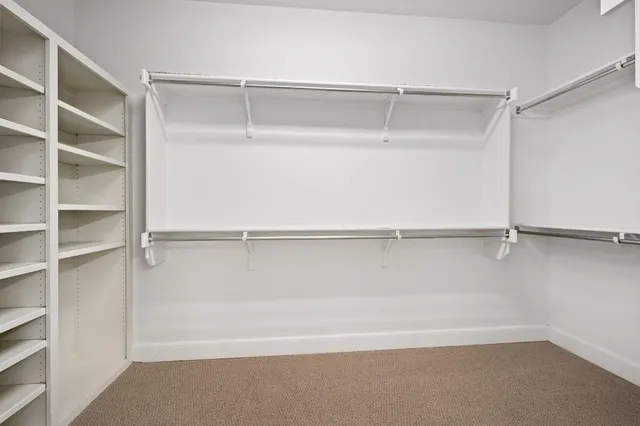 a view of an empty walk in closet