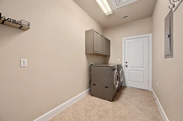 a view of kitchen with refrigerator and microwave