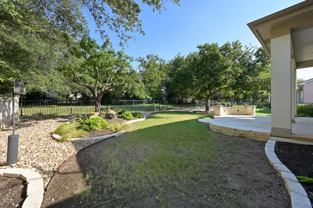 a view of a swimming pool with a patio